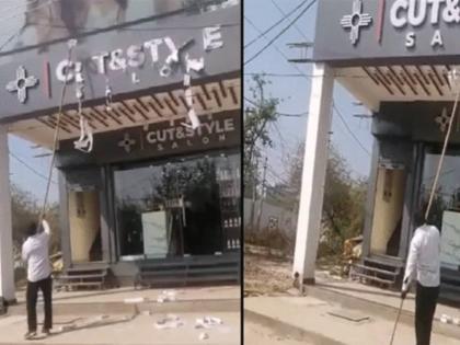 municipal Junior Engineer Wife Not Like Her Make Up Husband Sent Bulldozer Vandalized Salon | पत्नीला मेकअप नाही आवडला; पालिकेच्या अभियंत्यानं थेट ब्युटी पार्लरवर बुलडोझर चालवला