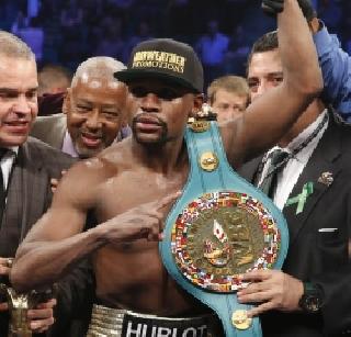 Mayweather becomes the king of boxing | बॉक्सिंगच्या महामुकाबल्यात मेवेदर ठरला किंग Mayweather becomes the king of boxing | बॉक्सिंगच्या महामुकाबल्यात मेवेदर ठरला किंग