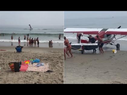 Banner plane crashes into sea in US lifeguards rush to rescue pilot watch video | VIDEO : सुमद्र किनारी एन्जॉय करत होते लोक, अचानक पाण्यात येऊ पडलं विमान आणि मग...