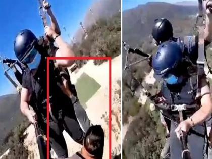 Scary video shows man hanging on to paraglider mid-air without harness | पॅराग्लायडरसोबत हवेत लटकला, हात सुटताच डोंगरावर पडला; ३० सेकंदाचा थरारक व्हिडीओ