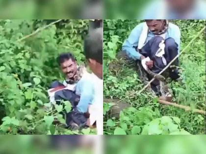 VIDEO : Man was go for toilet outside python catch him | VIDEO : उघड्यावर शौचास गेला अन् अजगराने विळखा घातला आणि मग...