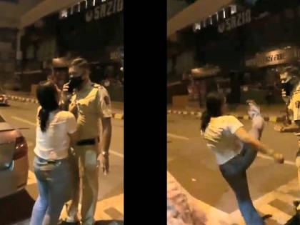 Video: Drunk woman kicks police and grabs his collar in Navi mumbai | Video : मद्यधुंद तरुणीने पोलिसावर लाथ उगारली अन् पकडली, भररस्त्यात केला तमाशा