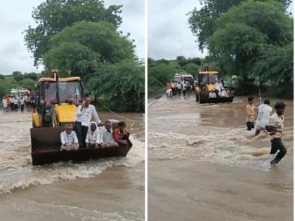 Video: Villagers ride on JCB to get through the flood waters | Video : नामी शक्कल !  पुराच्या पाण्यातून जाण्यासाठी ग्रामस्थ जेसीबीवर स्वार 