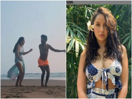 Nora Fatehi tough dance step with a friend on the beach, video goes viral | नोरा फतेहीचा समुद्र किनारी डान्स करतानाचा व्हिडीओ व्हायरल, यूजर म्हणाला - 'रामदेव बाबासोबत डान्स?'