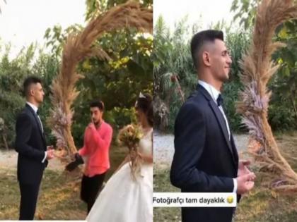 Groom went to kiss the bride, instead kissed photographer, see this funny video | अरे देवा! नवरीला किस करायला गेला अन् घडलं भलतंच, बघून पोट धरून हसाल....