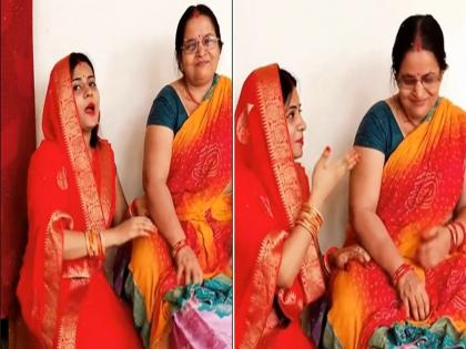 Video : Bahu threatened by holding the feet of sasu maa video goes viral on internet | VIDEO : सूनेने पाय पकडून सासूला दिली 'धकमी', म्हणाली - बेटा-बेटा ना कर सासू, अब तेरा बेटा मेरा है.