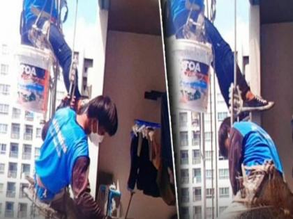 Thailand : Workers were repairing the window on the 32nd floor angry woman cut the rope | VIDEO : ३२व्या मजल्यावर खिडकीची दुरूस्ती करत होते वर्कर्स, रागावलेल्या महिलेने कापला दोर आणि...