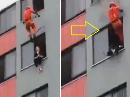 Woman on window of building attempt to suicide rescue by fire staff in Japan | खिडकीतून खाली उडी मारणार होती महिला, 'वरून' आलेल्या आलेल्या व्यक्तीने दिला धक्का आणि मग....