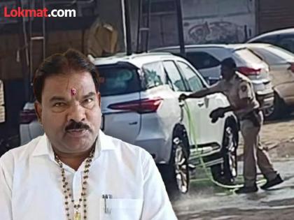 Video of policeman washing the car of Buldhana Shinde group MLA Sanjay Gaikwad is going viral | CM शिंदेंच्या आमदाराची गाडी धुताना पोलीस कर्मचारी कॅमेरात कैद; काँग्रेस नेत्याने समोर आणला व्हिडीओ