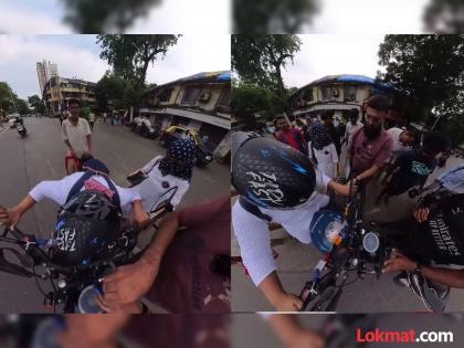 VIDEO : Woman scarf gets caught in bike passer by comes to her rescue | VIDEO : भर रस्त्यात बाइकच्या चाकामध्ये अडकला होता महिलेचा दुपट्टा आणि मग...