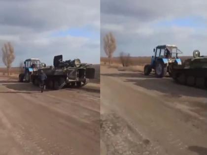 Ukraine Farmer Russian Tank Viral Video: Ukrainian farmer connect tracter to Russian tanks and fled Video goes viral | Ukraine Farmer Russian Tank Viral Video: हसून हसून, पोटात दुखेल! युक्रेनच्या शेतकऱ्याने रशियन रणगाड्याची वाजवली पुंगी; ट्रॅक्टरला जोडला आणि घेऊन पळाला