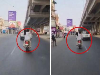 Lucknow Video: Young woman beats young man with slippers on a running bike | VIDEO: धावत्या बाईकवर तरुणीची तरुणाला चप्पलने मारहाण; 20 सेकंदात 14 वेळा झोडपले Lucknow Video: Young woman beats young man with slippers on a running bike | VIDEO: धावत्या बाईकवर तरुणीची तरुणाला चप्पलने मारहाण; 20 सेकंदात 14 वेळा झोडपले