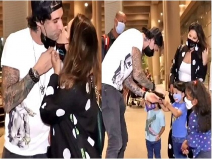 Sunny Leone takes off her mask and kisses her husband in front Her Children On Airport, video goes viral | Sunny Leone ने मास्क काढला आणि सा-यांसमोर पतीला केले Kiss, व्हिडीओ व्हायरल