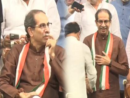 Uddhav Thackeray has been criticized by the BJP for wearing the Congress flag at the Rajiv Gandhi Sadbhavana Divas event | उद्धव ठाकरेंच्या गळ्यात काँग्रेसचे उपरणं; भाजप म्हणतं, "विचारधारा पायात आणि..."