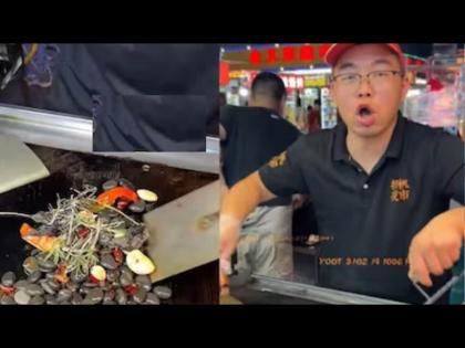 China street vendor sells stir fried pebbles with chilli and garlic | लसूण-मिरचीसोबत खडे खाण्याचा आनंद घेत आहेत लोक, जाणून घ्या या अनोख्या डिशबाबत!