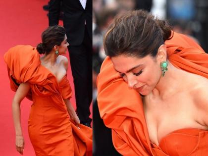 Deepika Padukone Struggle In Orange Gown At Cannes 2022 | Cannes 2022 : अनोख्या ड्रेसमुळे दीपिकाचे हाल, कान्स रेड कार्पेटवर गाऊन सांभाळता सांभाळता आले नाकीनऊ