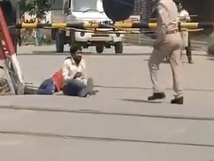 CoronaVirus up police taking action against 2 policemen after hapur incident video goes viral kkg | CoronaVirus News: कडाक्याच्या उन्हात मजुरांना रस्त्यावर लोटांगण घालण्याची शिक्षा; पोलिसांवर होणार कारवाई