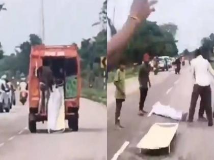 viral video Body thrown from moving ambulance on road, video goes viral; Police reveal truth behind incident | संतापजनक! चालत्या रुग्णवाहिकेतून मृतदेह रस्त्यावर फेकला, व्हिडीओ व्हायरल; पोलिसांनी घटनेमागचे सत्य सांगितले viral video Body thrown from moving ambulance on road, video goes viral; Police reveal truth behind incident | संतापजनक! चालत्या रुग्णवाहिकेतून मृतदेह रस्त्यावर फेकला, व्हिडीओ व्हायरल; पोलिसांनी घटनेमागचे सत्य सांगितले