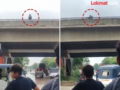 He had an argument with his wife and came to the flyover to commit suicide; watch the video of what happened next | पत्नीसोबत वाद झाला आणि तो आत्महत्या करण्यासाठी उड्डाण पुलावर आला; पुढे काय घडलं व्हिडीओ बघा