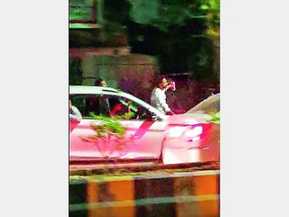 video viral of a goon making chaos in nagpur drinking alcohol sitting on the bonnet of a car | कारच्या बोनेटवर बसून गुंडांचा हैदोस; दारूच्या नशेत शिव्या देतानाचा व्हिडिओ व्हायरल