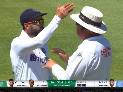 IND vs SA, 3rd Test Day 2 Live Updates : An unpleased virat Kohli reacts animatedly after umpire Erasmus issues warning to Moh. Shami, Watch Video  | IND vs SA, 3rd Test Live Updates : अम्पायरनं मोहम्मद शमीला दम भरला, विराट कोहली अंगावर धावून गेला; Video 