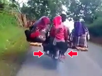 desi jugaad of man riding bike with 9 passengers video goes viral on social media | अरे...बाईक आहे की प्लेन? देसी जुगाडाचा हा भन्नाट व्हिडिओ पाहुन तुम्हालाही पडेल हाच प्रश्न