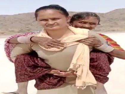 woman constable of gujarat police saved life of elderly person example of humanity is being discussed | कडक सॅल्यूट! रणरणत्या उन्हात वृद्ध महिलेला घेतलं पाठीवर; जीव वाचवण्यासाठी पोलिसाची धडपड