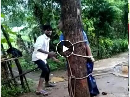 Crime News women tied on tree for seven hours and brutally beaten by her husband in banswada | Video - पती झाला हैवान! मित्राकडून लिफ्ट घेतली म्हणून पत्नीला शिक्षा, 7 तास झाडाला बांधलं, मारलं अन्...