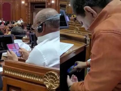 samajwadi party share video of up bjp mla chewing tobacco and playing mobile game in assembly session | कोणी पत्ते खेळतंय तर कोणी तंबाखू मळतंय; भाजपा आमदारांचे विधानसभेतील 'ते' Video व्हायरल