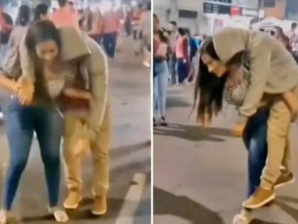 Hero woman carries drunk, stumbling boyfriend home on her back in viral video | नशेत तर्रर्र असलेल्या बॉयफ्रेंडला खांद्यावर उचलून थेट घरी गेली गर्लफ्रेंड, Video जोरदार व्हायरल