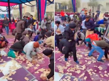 amritsar video of punjabi wedding is going viral on social media picking up notes | Video - लग्नात डीजे फ्लोरवर उडवले लाखो रुपये; जमा करण्यासाठी पाहुण्यांची झुंबड, धक्काबुक्की