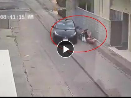 mother tries to shield the baby from car accident shocking video viral on social media | शेवटी आईच ती! बाळाला वाचवण्यासाठी स्वतःचा जीव घातला धोक्यात; थरकाप उडवणारा Video