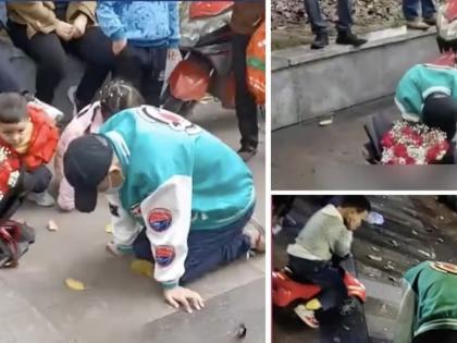 spends night in rain on knees chinese man begging sorry to girlfriend | भर पावसात 21 तास गुडघ्यावर बसला, फुलांचा गुच्छ घेऊन गर्लफ्रेंडची माफी मागत राहिला पण...