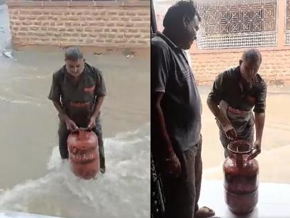 gas delivery man deliver cylinder in rain at home union minister shares video | Video - मुसळधार पावसात सिलिंडर पोहोचवण्यासाठी डिलिव्हरी मॅनची धडपड; केंद्रीय मंत्री म्हणतात...