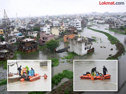 Villages near Nagpur flooded, 50 people trapped in flood were rescued | नागपूर लगतची गावे पुरात, पुरात अडकलेल्या ५० लाेकांना रेस्क्यू करण्यात यश Villages near Nagpur flooded, 50 people trapped in flood were rescued | नागपूर लगतची गावे पुरात, पुरात अडकलेल्या ५० लाेकांना रेस्क्यू करण्यात यश