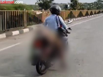 No one stopped... Husband's unfortunate journey with his dead wife tied to a bike! | कोणीही थांबलं नाही... मृत पत्नीला दुचाकीला बांधून पतीचा दुर्दैवी प्रवास!