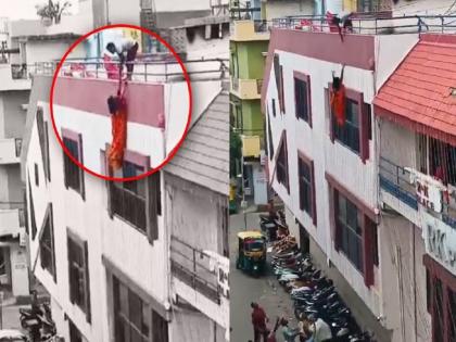 woman washing dishes on the roof of the house fell on ground watch the shocking VIDEO | घराच्या छतावर भांडी घासणाऱ्या महिलेचा साबणावर पाय पडला अन्...पाहा धक्कादायक VIDEO