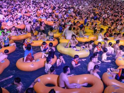 People in China gather in large numbers to party at Wuhan Water Park without wearing mask
