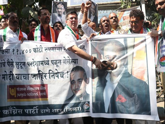 Prasad of the couple with the image of Nirwa Modi in Thane, NCP's movement in Thane | ठाण्यात निरव मोदीच्या प्रतिमेला जोड्यांचा प्रसाद, ठाण्यात राष्ट्रवादीचे आंदोलन Prasad of the couple with the image of Nirwa Modi in Thane, NCP's movement in Thane | ठाण्यात निरव मोदीच्या प्रतिमेला जोड्यांचा प्रसाद, ठाण्यात राष्ट्रवादीचे आंदोलन