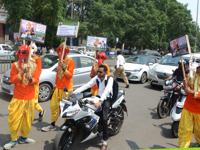 Public awareness about Shree Ganesha's helmet ... | श्रीगणेशाची हेल्मेटबाबत जनजागृती़... Public awareness about Shree Ganesha's helmet ... | श्रीगणेशाची हेल्मेटबाबत जनजागृती़...