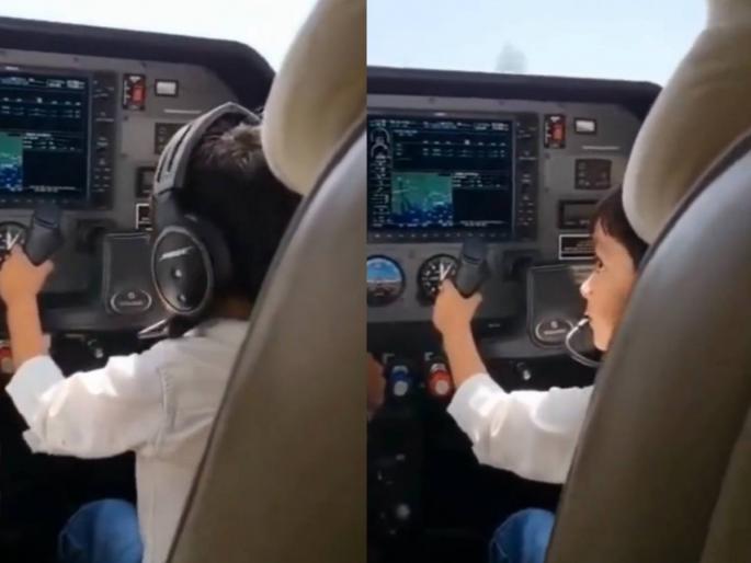 A video of a child sitting in the cockpit instead of the pilot while the plane is taking off from the runway at Surat airport is going viral | धावपट्टीवर धावत होते विमान, कॉकपिटमध्ये पायलटऐवजी बसले होते मूल, सुरत विमानतळावरील Video Viral A video of a child sitting in the cockpit instead of the pilot while the plane is taking off from the runway at Surat airport is going viral | धावपट्टीवर धावत होते विमान, कॉकपिटमध्ये पायलटऐवजी बसले होते मूल, सुरत विमानतळावरील Video Viral