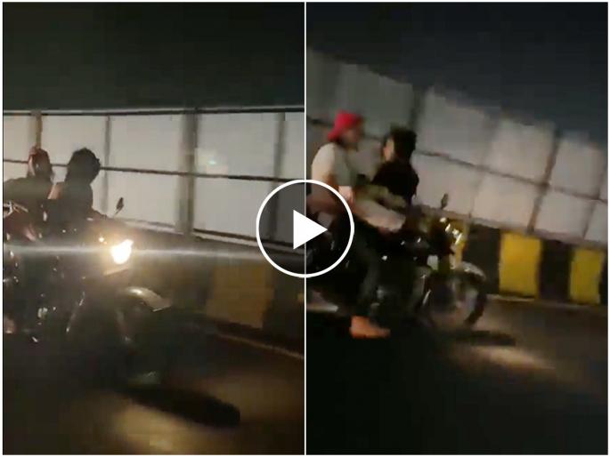 A video of a couple romancing on a running bike is going viral in Uttar Pradesh's Lucknow | प्रेमी युगुलाला आली रोमान्सची 'लहर', चालत्या बुलेटवर उलटी बसून तरूणीनं केला 'कहर' A video of a couple romancing on a running bike is going viral in Uttar Pradesh's Lucknow | प्रेमी युगुलाला आली रोमान्सची 'लहर', चालत्या बुलेटवर उलटी बसून तरूणीनं केला 'कहर'