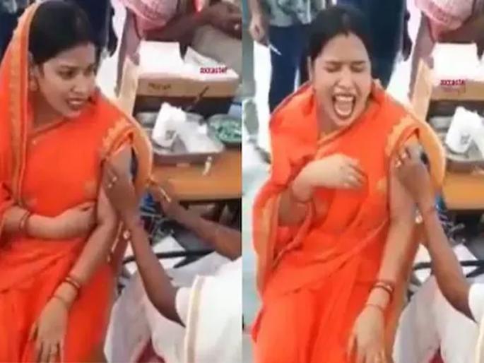 A video of a woman being vaccinated is currently going viral on social media | Video: लस घेणाऱ्या महिलेची झाली भयंकर अवस्था; तिला पाहून आजूबाजूचे लोकही घाबरले A video of a woman being vaccinated is currently going viral on social media | Video: लस घेणाऱ्या महिलेची झाली भयंकर अवस्था; तिला पाहून आजूबाजूचे लोकही घाबरले