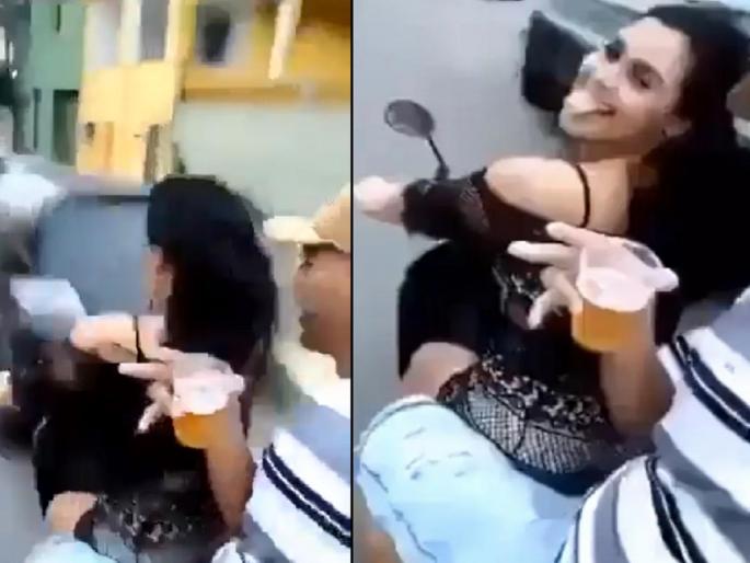 Viral Video: Couple's booz party on a running scooty; Then the accident happened, watch the video | Video: धावत्या स्कूटीवर कपलची दारू पार्टी; तेवढ्यात झाला अपघात, पाहा व्हिडिओ... Viral Video: Couple's booz party on a running scooty; Then the accident happened, watch the video | Video: धावत्या स्कूटीवर कपलची दारू पार्टी; तेवढ्यात झाला अपघात, पाहा व्हिडिओ...