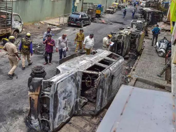 congress People Were Involved In Bangalore Violence Said Karntaka Deputy Cm | बंगळुरू हिंसाचारात काँग्रेसच्या लोकांचा सहभाग; कर्नाटक सरकारचा गंभीर आरोप congress People Were Involved In Bangalore Violence Said Karntaka Deputy Cm | बंगळुरू हिंसाचारात काँग्रेसच्या लोकांचा सहभाग; कर्नाटक सरकारचा गंभीर आरोप