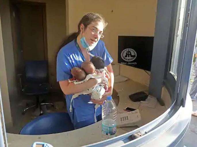 Beirut Blast Nurse Holding 3 Babies and Attending Calls amid Shattered Glass | Beirut Blast: ड्युटी फर्स्ट! स्फोटांनी समोरच्या काचा फुटल्या; पण 'ती' नर्स तीन बाळांना घेऊन कामात व्यस्त Beirut Blast Nurse Holding 3 Babies and Attending Calls amid Shattered Glass | Beirut Blast: ड्युटी फर्स्ट! स्फोटांनी समोरच्या काचा फुटल्या; पण 'ती' नर्स तीन बाळांना घेऊन कामात व्यस्त