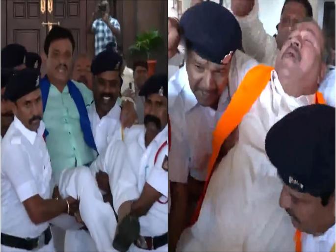 18 Karnataka BJP MLAs being carried out of the Assembly after their suspension | कर्नाटक विधानसभेत राडा, १८ जण निलंबित; भाजपा आमदारांना उचलून सभागृहाबाहेर काढलं 18 Karnataka BJP MLAs being carried out of the Assembly after their suspension | कर्नाटक विधानसभेत राडा, १८ जण निलंबित; भाजपा आमदारांना उचलून सभागृहाबाहेर काढलं