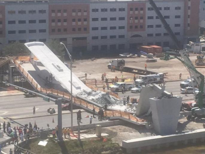 Four people were killed and 9 others injured when a pedestrian bridge collapsed in Florida | फ्लोरिडात पादचारी पूल कोसळल्यानं 4 जणांचा मृत्यू, 9 जण जखमी Four people were killed and 9 others injured when a pedestrian bridge collapsed in Florida | फ्लोरिडात पादचारी पूल कोसळल्यानं 4 जणांचा मृत्यू, 9 जण जखमी