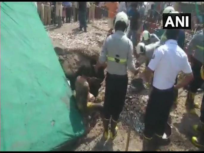 One person rescued, a woman and a child still stuck in septic tank they fell in after a truck hit the slab covering tank | चेंबूरमध्ये ट्रकची स्लॅबला धडक, 3 जण सेप्टीक टँकमध्ये पडले One person rescued, a woman and a child still stuck in septic tank they fell in after a truck hit the slab covering tank | चेंबूरमध्ये ट्रकची स्लॅबला धडक, 3 जण सेप्टीक टँकमध्ये पडले