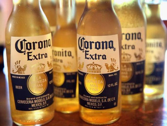 Corona beer suspends production amid coronavirus outbreak kkg | CoronaVirus: 'कोरोना'लाही कोरोनाचा फटका; उत्पादन थांबवण्याचा कंपनीचा निर्णय Corona beer suspends production amid coronavirus outbreak kkg | CoronaVirus: 'कोरोना'लाही कोरोनाचा फटका; उत्पादन थांबवण्याचा कंपनीचा निर्णय